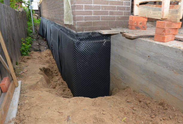 Happy homeowners after waterproofing job in Tecumseh
